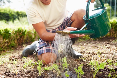 Gardener starting work with tools in a Mayfair garden